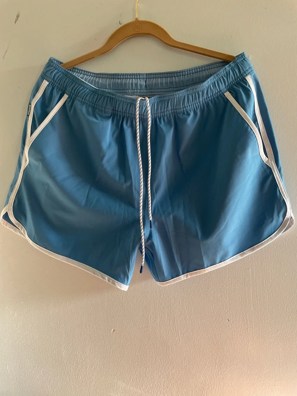 Bonobos Colorful swim trunks with a shorter, curved hem , just like your dad